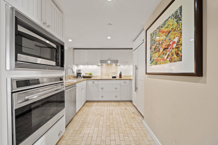Fully equipped kitchen is adorned with luxury appliances to make any chef feel right at home