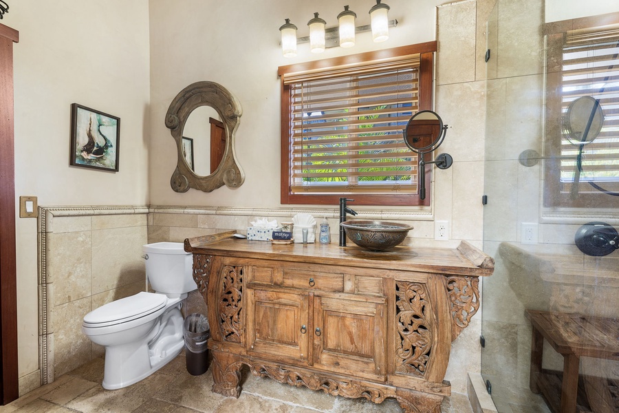 Rustic vanity with copper sink and warm wood tones—artful design and comfort combined.
