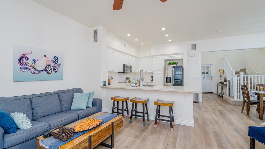 The open floor plan with bar seating at the kitchen.