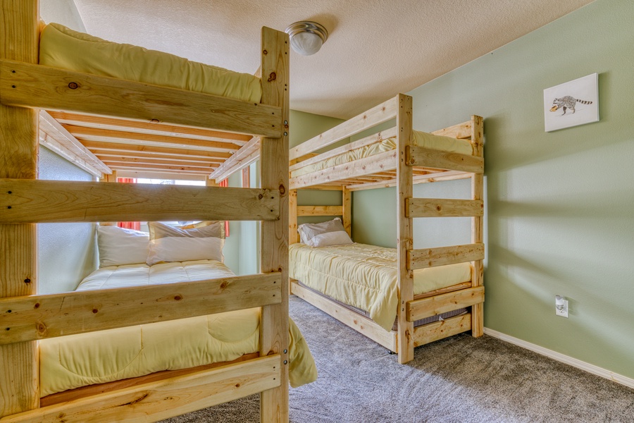 The Bunk bedroom comes with 2 Twin bunk beds (sleeps four guests total) and a comfy room for kids or additional guest