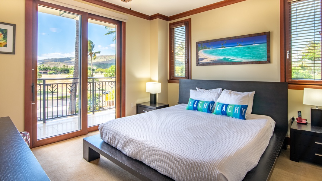 The large primary guest bedroom with a king size platform bed and incredible views.