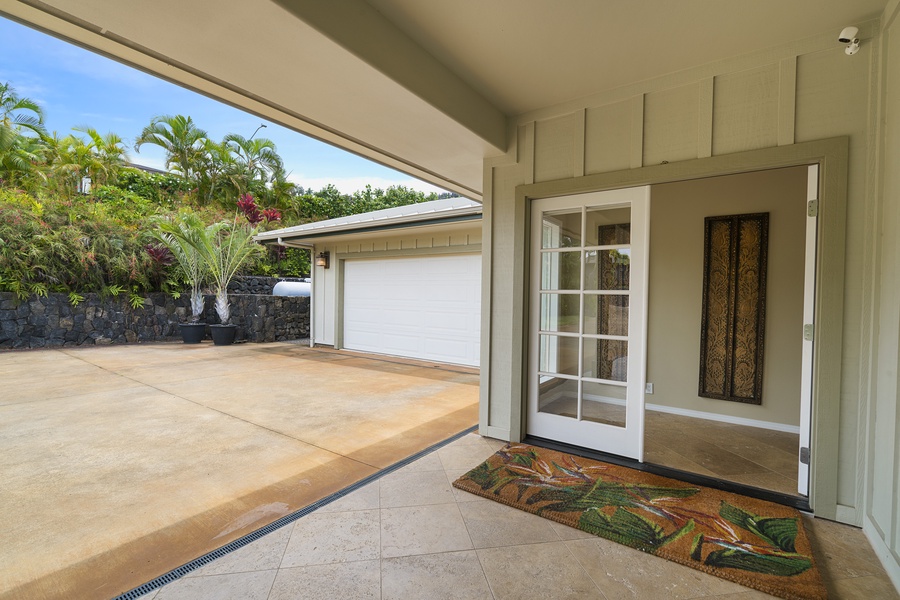 Shaded entry with tile accents offers a cool, welcoming space to come and go with ease.