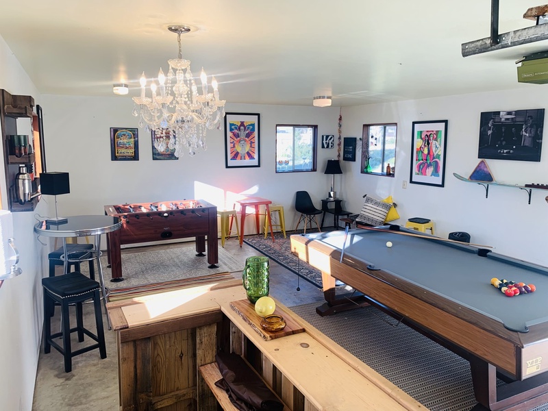 the detached clubhouse, which houses a pool table, foosball table, and wet bar