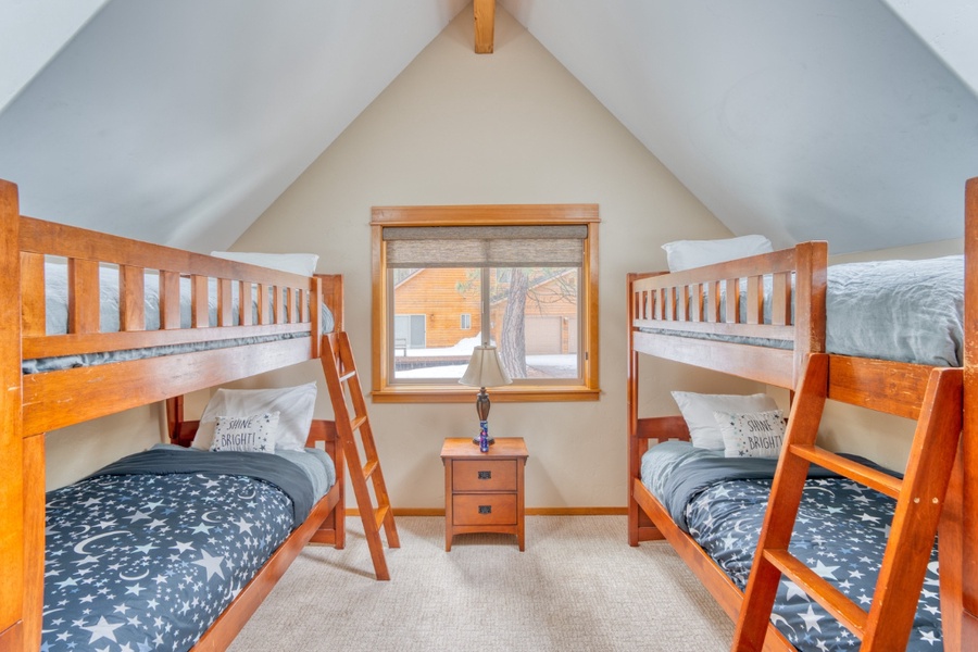 The guest bedroom with two twin-over-twin bunk beds