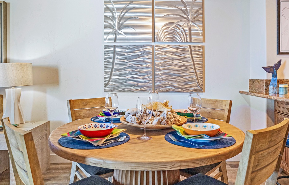 Dine at Mahana 1118’s round wooden table, set for intimate ocean-view meals.