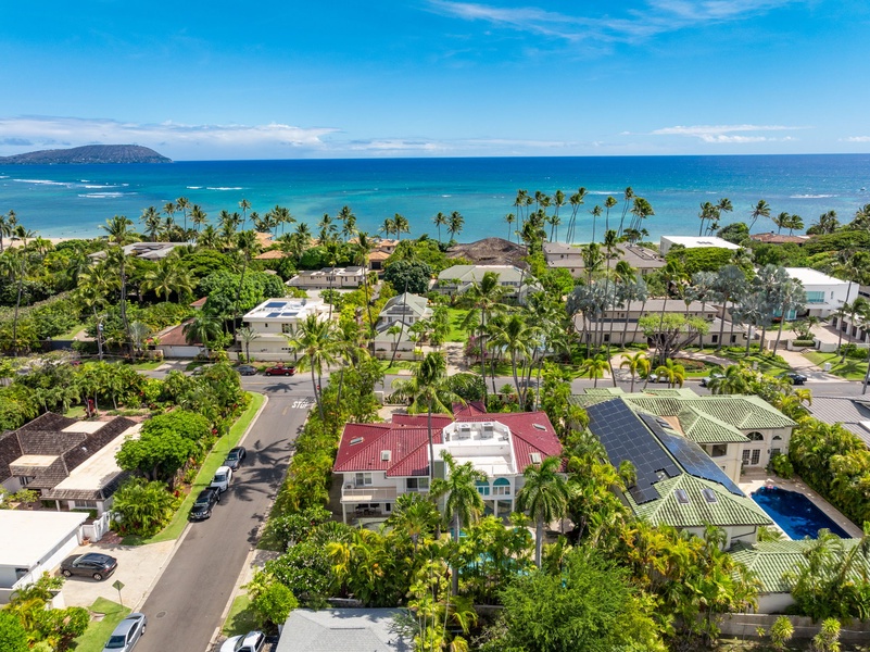 Scenic aerial view of the neighborhood with breathtaking ocean views in the distance.