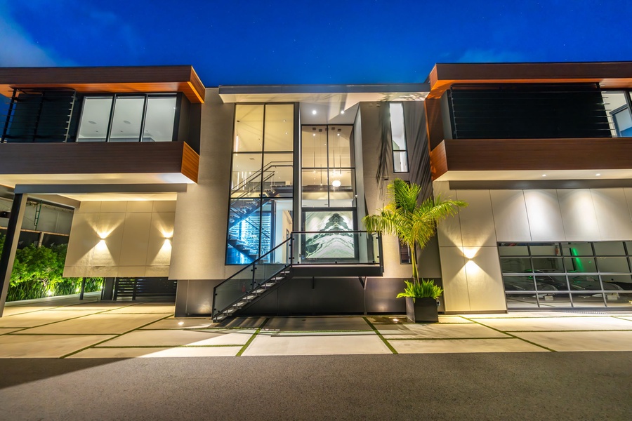 A grand entrance sets the tone for modern luxury—where clean lines meet tropical charm.