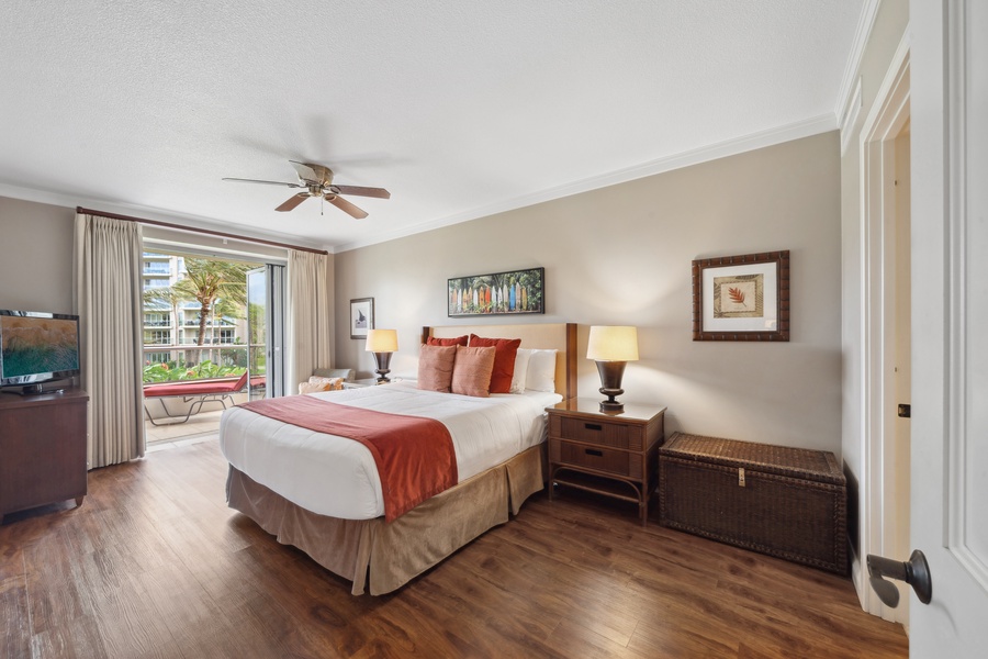 The calming bedroom at Honua Kai Konea 204 offers a king bed and lush views for deep island rest.
