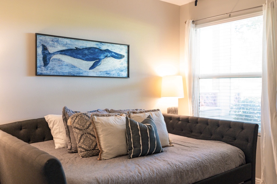 Guestroom offers a queen bed with a full sized trundle bed underneath