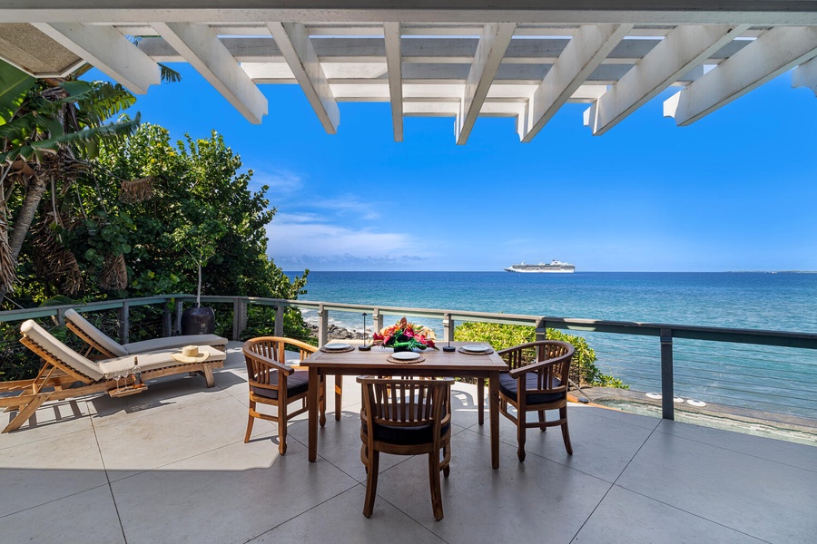 Covered oceanfront lanai invites unforgettable meals, dolphin watching, and front-row sunset shows.