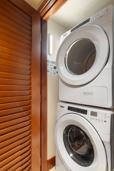 A laundry nook with a stacked washer-dryer.