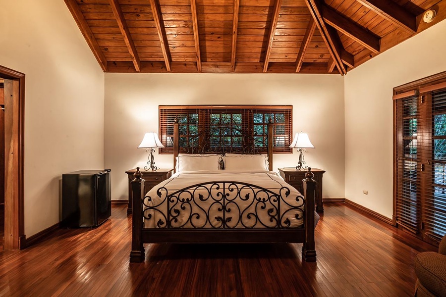 The fourth guest bedroom also features a comfortable bed and a mini fridge for easy access to refreshments..
