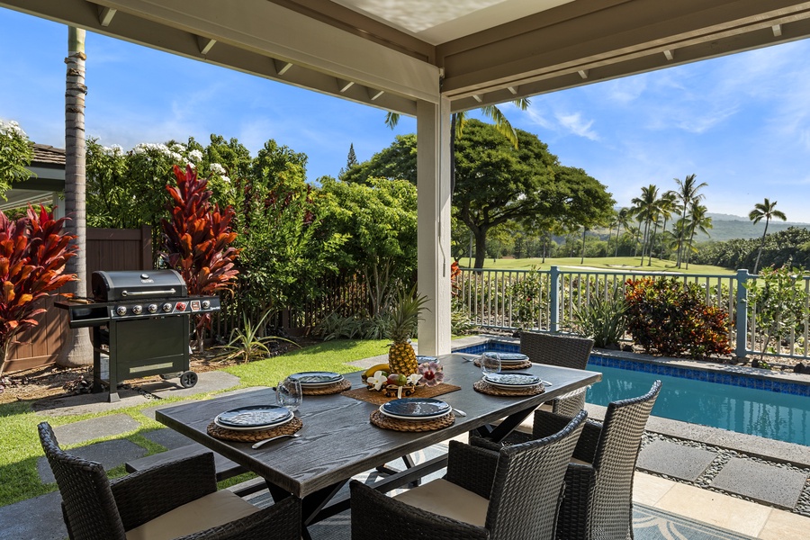 Dine al fresco on the lanai at Kona Blue Vacations Holua Kai, surrounded by lush greenery and resort privacy.