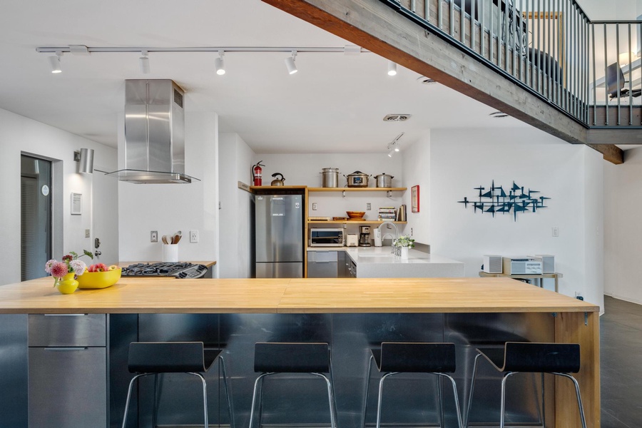 Kitchen island/bar for quick meals and entertainment.