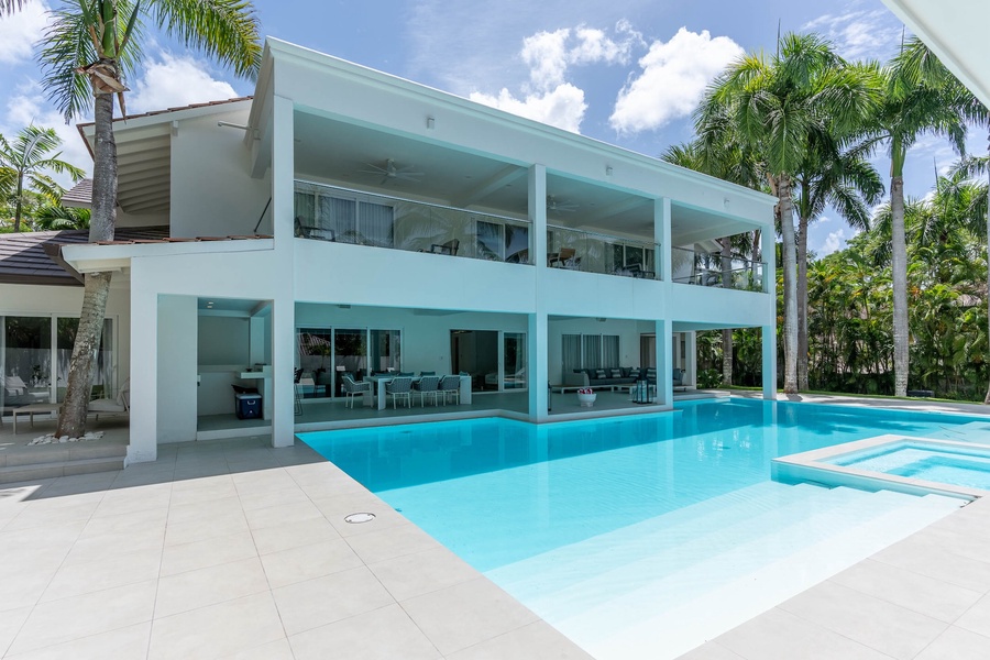Take a refreshing dip in the sparkling pool and enjoy the spacious outdoor living area.
