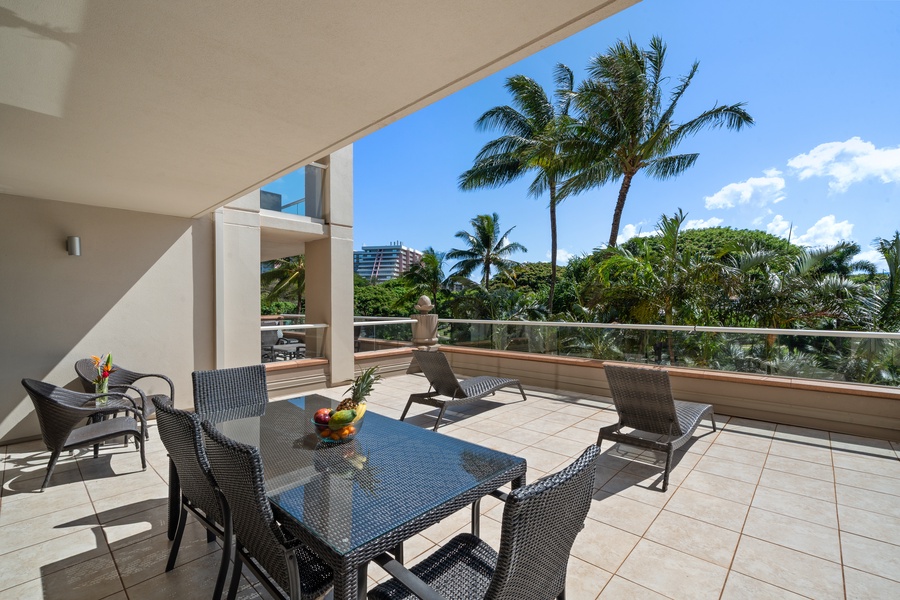 Shaded lanai space at Honua Kai Konea 230/232 includes lounge and dining seating