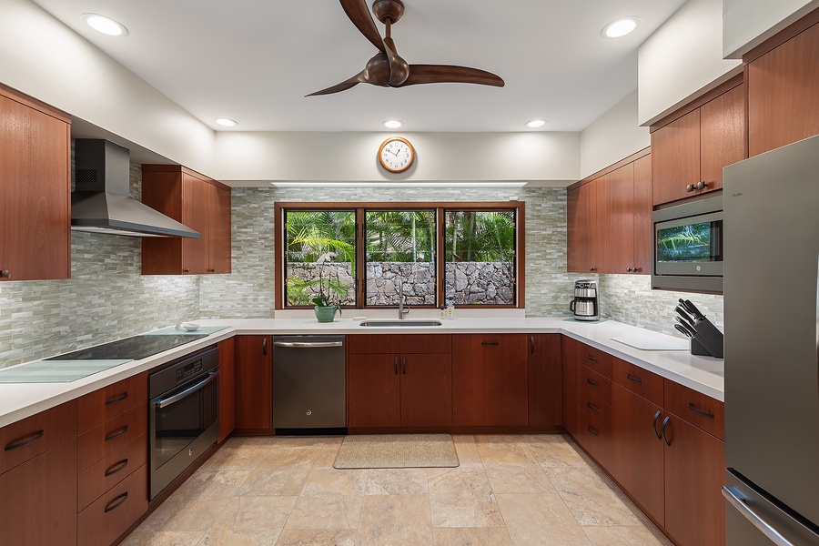 Main house modern kitchen with high-end appliances and sleek countertops, perfect for preparing meals.