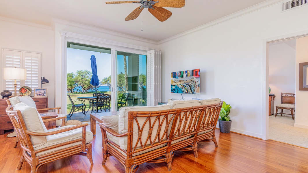 Sink in to the living room couch for a view of the lanai and ocean breezes.