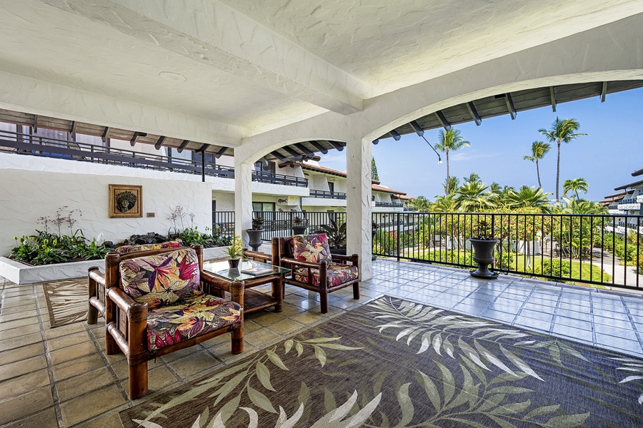 Casa De Emdeko shaded seating area at the entrance to the complex