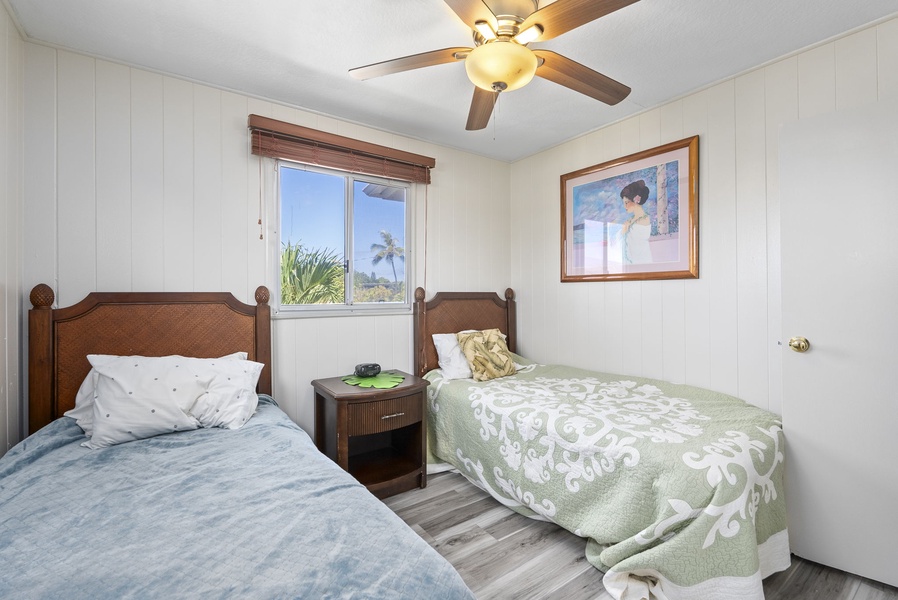 Twin beds in second suite, ideal for families or friends traveling together.