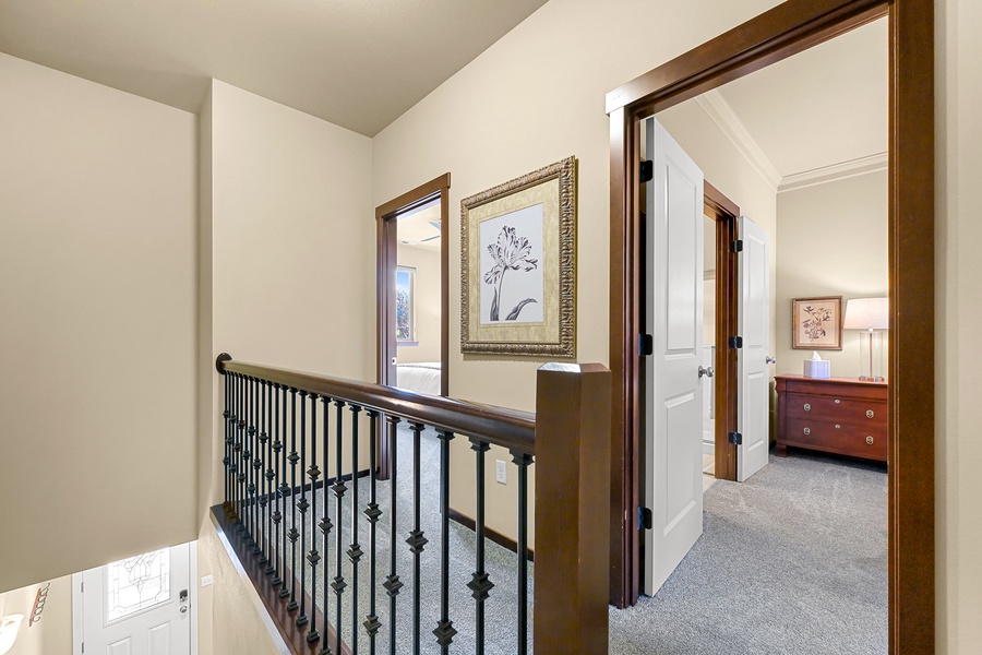 Head upstairs to discover serene sleeping quarters with plush bedding and ensuite baths.