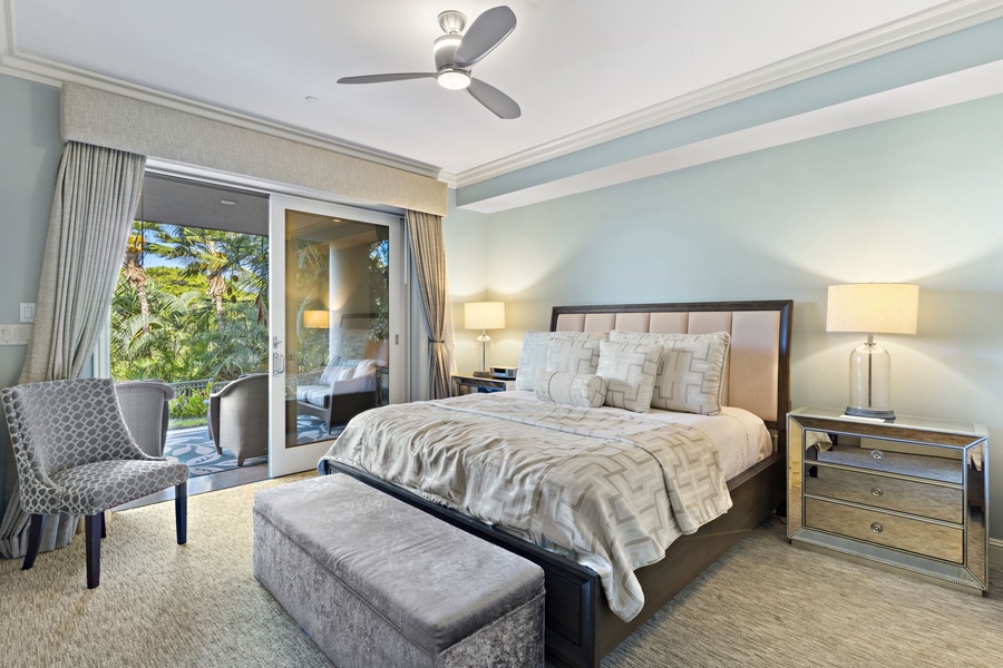 The second bedroom at Wailea Hoolei 93-3 features a king-sized bed and its own private lanai.