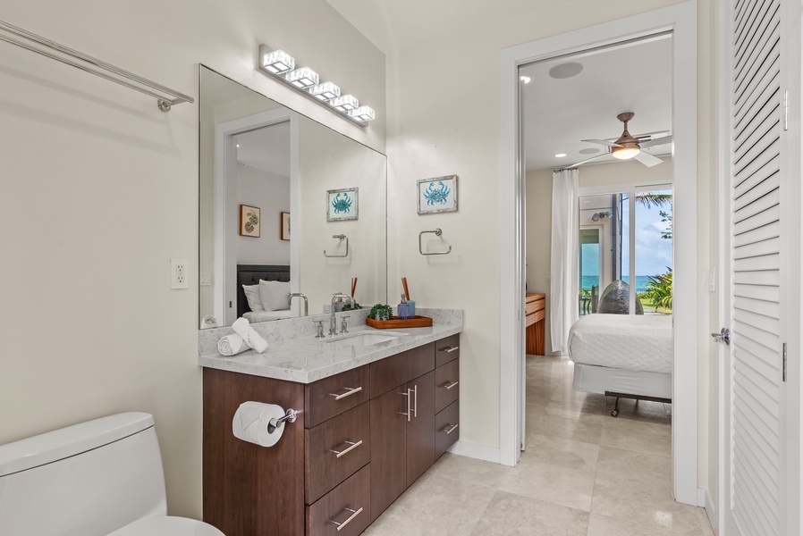 The ensuite bathroom has ample vanity space and an outdoor shower.