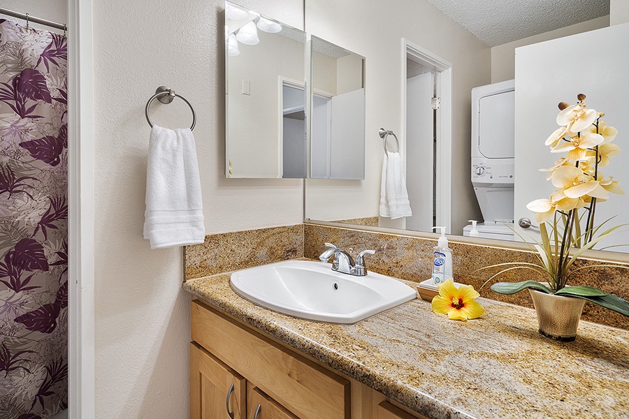 Guest bathroom with full sized Washer & Dryer