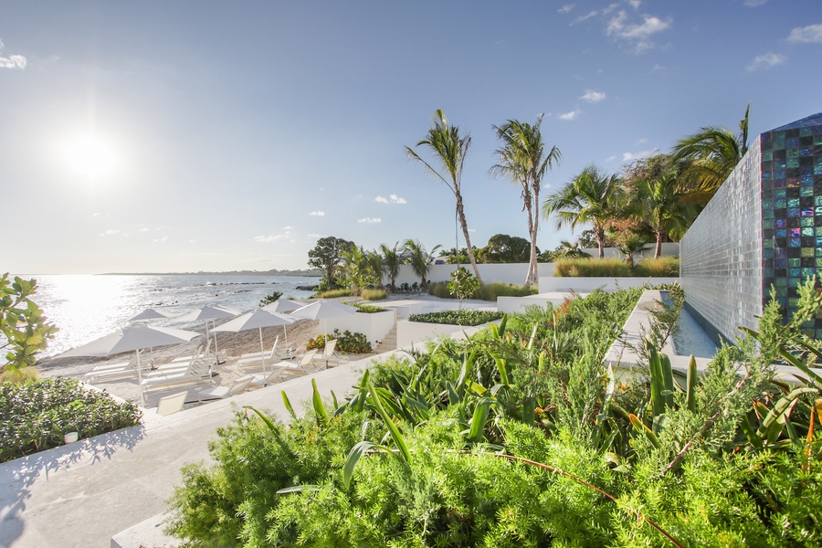 The private beach terrace with comfortable loungers and spectacular ocean vistas.