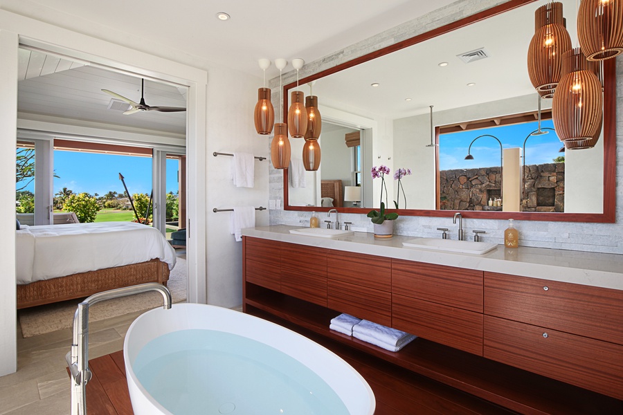 Primary bathroom soaking tub and vanity