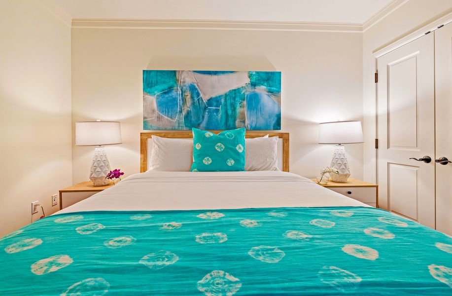 Cozy guest room at Honua Kai Konea 206 with turquoise accents and peaceful ambiance.