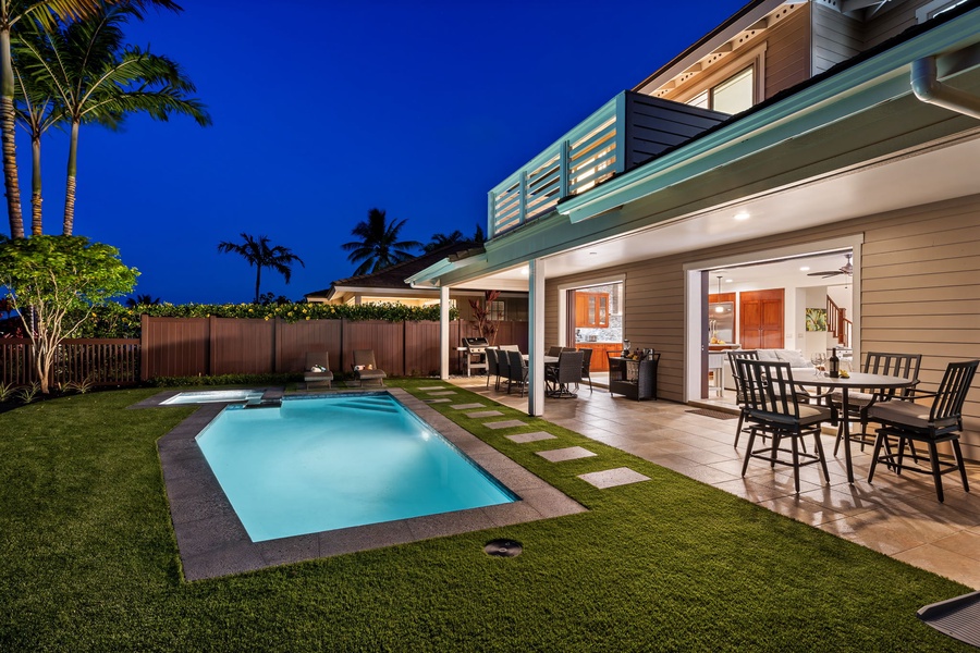 Take an evening dip in the sparkling pool under the twilight sky.