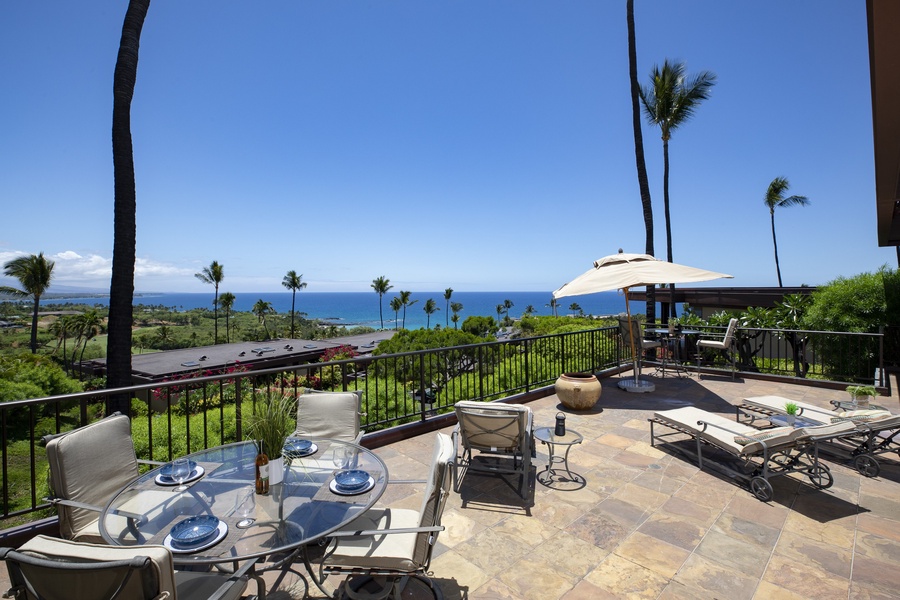 Spacious lanai overlooking Mauna Kea and Hapuna Beach, ideal for alfresco dining and lounging.