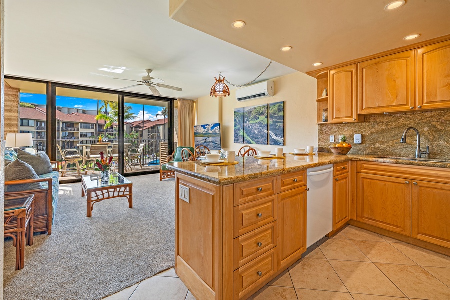 The kitchen opens up to the living area, allowing you to cook while still being part of the conversation and enjoying the views from the lanai.