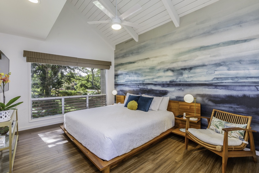 In the primary bedroom, linger in your brand new King-size bed as you enjoy the charming garden views outside the picture window, as well as the natural light enhanced by the room’s vaulted ceilings.