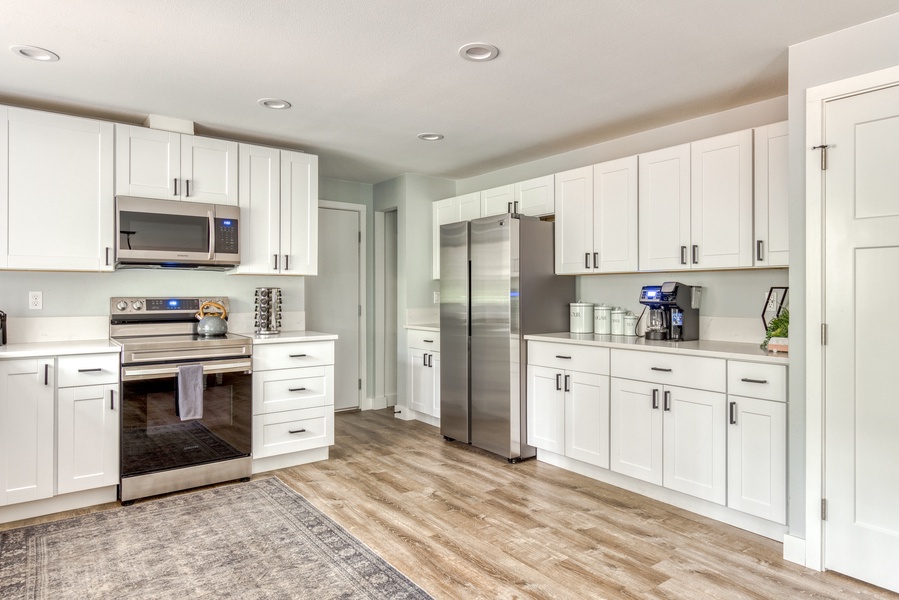 Sleek and modern kitchen equipped with stainless steel appliances and plenty of counter space—ideal for creating culinary delights.