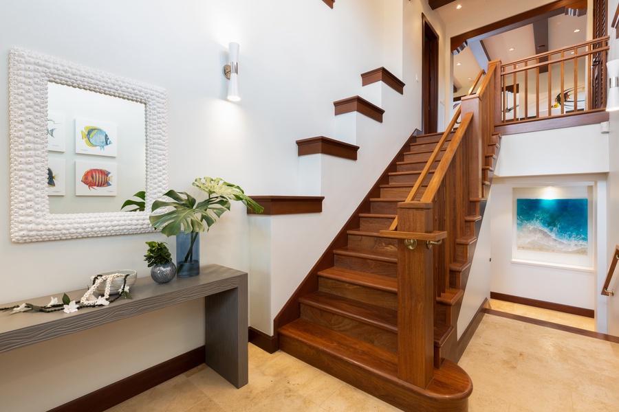 The tasteful foyer invites you to step foot inside this gorgeous home. Great room and kitchen are upstairs, bedrooms are downstairs