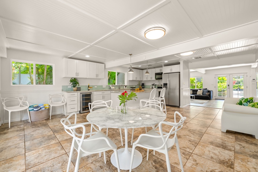 The bright, airy dining space where meals become memories. The open layout flows seamlessly into your fully-equipped kitchen and cozy living area, perfect for effortless entertaining.
