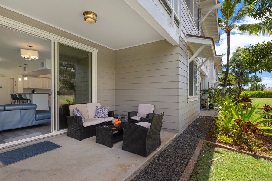 Unwind on your private lanai with tropical garden views, where comfortable seating awaits your morning coffee or evening relaxation.
