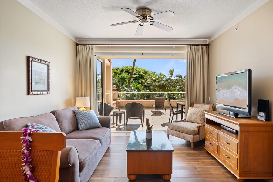 Full-length sliding doors in the living room of Honua Kai Konea 230/232 bring natural light and mountain views inside.