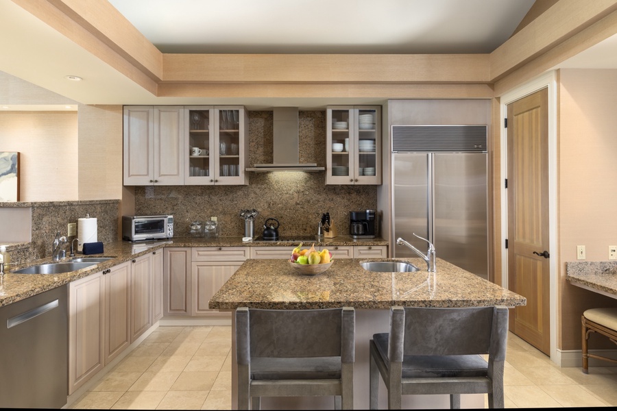 Ample counter space, top tier appliances and gleaming granite - a chef’s delight!