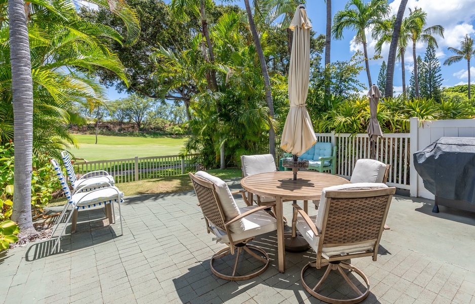 Your private lanai dining awaits, framed by swaying palms and golf course views—perfect for morning coffee or sunset dinners.