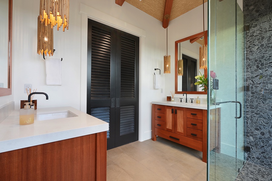 Primary ensuite with dual vanity space and walk in shower is a private retreat..