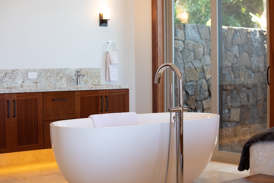 Soaking tub and a private outdoor shower with ocean view!