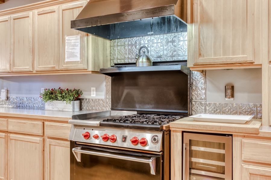 Easy meal prep with a fully-stocked kitchen with stainless steel appliances.