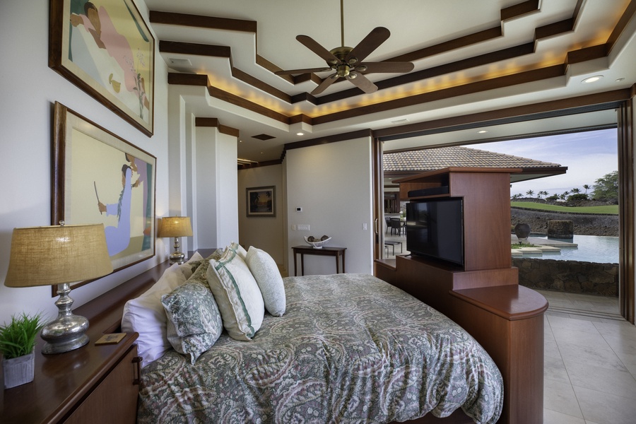 Wake up to serene water views in your elegant suite, where rich wood details and island-inspired comfort create your perfect tropical sanctuary.