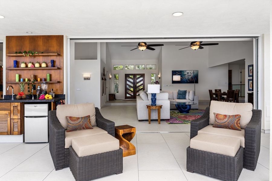 Indoor-outdoor continuity flows effortlessly, blending covered lanai comfort with air-conditioned interiors.