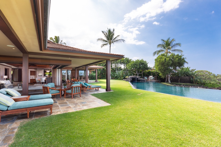 Sprawling lawn space and shaded lanai, perfect for family fun or quiet relaxation.