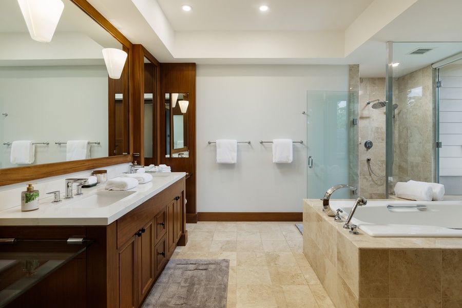 Wide and roomy ensuite with dual vanity spaces, perfect for couples getting ready for a day of adventures.