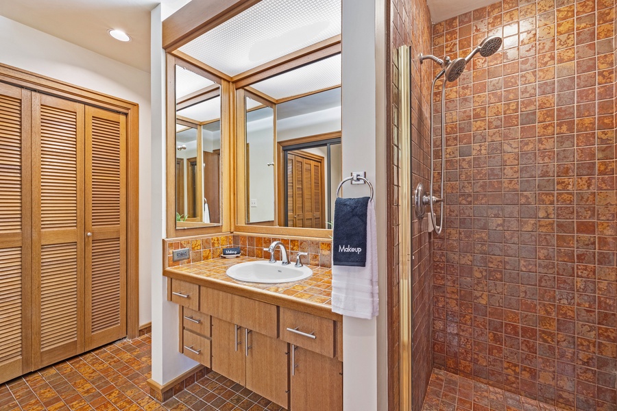Refresh in the sleek bathroom at Kapalua Ridge 2321, complete with a walk-in shower and bright vanity.